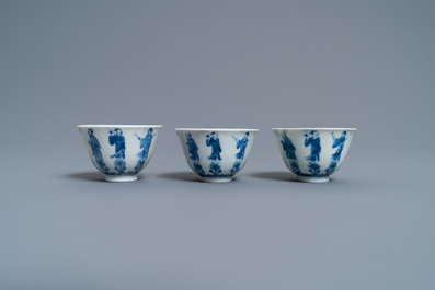 Three Chinese blue and white cups and two saucers, Kangxi
