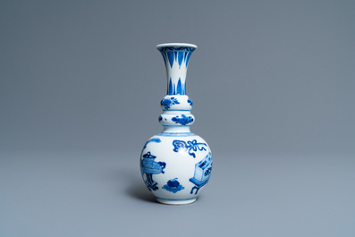 A Chinese blue and white triple gourd 'antiquities' vase, Kangxi