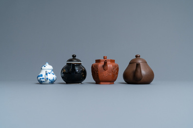Four Chinese Yixing stoneware, blue and white and monochrome black porcelain teapots, Kangxi and later