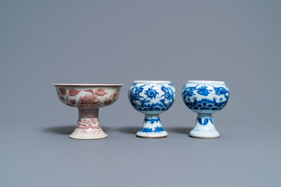 A pair of Chinese blue and white 'dragon' stem cups and one in copper-red, 19/20th C.