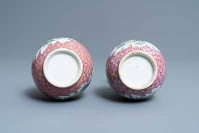 A pair of Chinese famille rose bottle vases with floral design, 19/20th C.