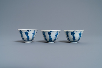 Three Chinese blue and white cups and two saucers, Kangxi