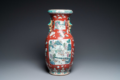 A Chinese famille rose ruby-ground vase, 19th C.