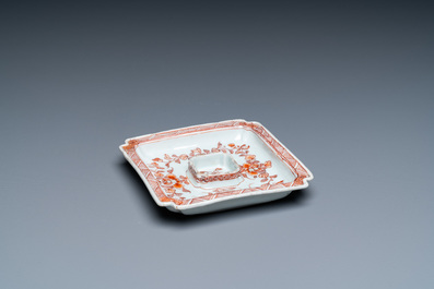 A square Chinese iron-red and gilt trembleuse cup stand with floral design, Jiajing mark, Kangxi