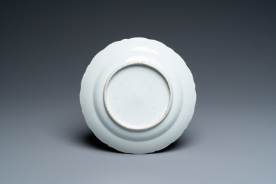 A Chinese iron-red, gilt and blue and white covered bowl on stand, 19th C.