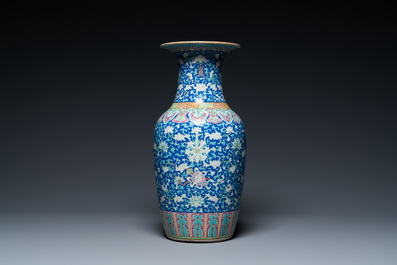 A Chinese famille rose blue-ground 'bajixiang' vase, 19th C.