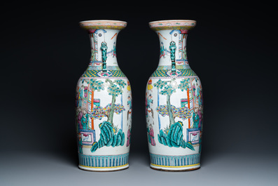A pair of Chinese famille rose vases with temple scenes, 19th C.
