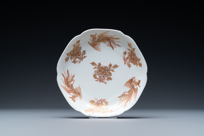 A Chinese iron-red and gilt 'phoenixes' cup and saucer, Kangxi