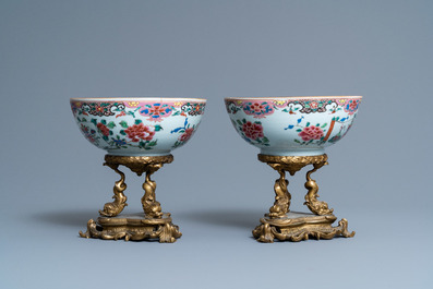 A pair of Chinese famille rose bowls on gilt bronze stand and a 'mandarin' mug, Qianlong