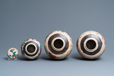 A pair of Chinese famille rose Nanking crackle-glazed jars and a jar with cover, 19th C.