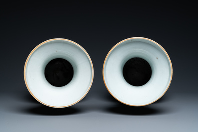 A pair of Chinese famille rose vases with temple scenes, 19th C.