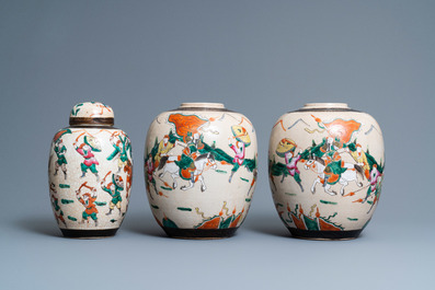 A pair of Chinese famille rose Nanking crackle-glazed jars and a jar with cover, 19th C.
