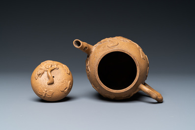 A Chinese Yixing stoneware teapot with squirrels and butterflies, seal mark, 18th C.