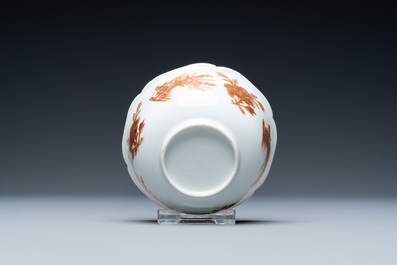 A Chinese iron-red and gilt 'phoenixes' cup and saucer, Kangxi