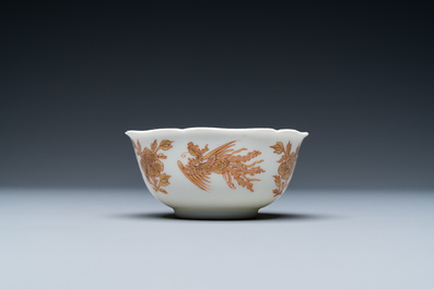 A Chinese iron-red and gilt 'phoenixes' cup and saucer, Kangxi