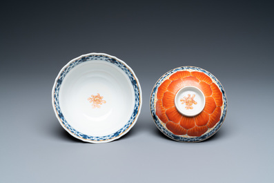 A Chinese iron-red, gilt and blue and white covered bowl on stand, 19th C.