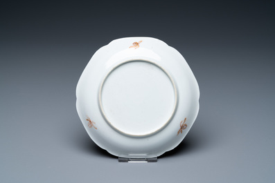 A Chinese iron-red and gilt 'phoenixes' cup and saucer, Kangxi