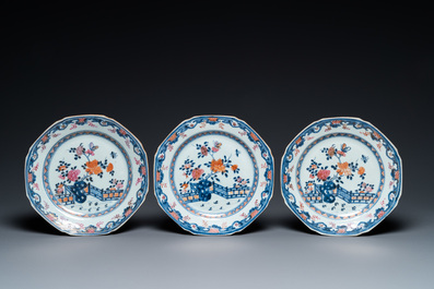 Eight Chinese famille rose plates and three famille verte cups, Kangxi/Qianlong