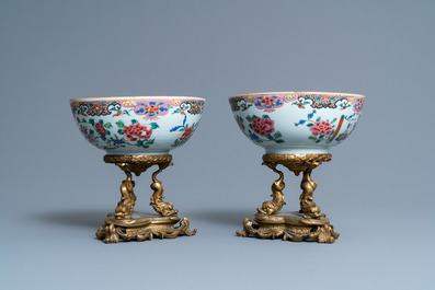 A pair of Chinese famille rose bowls on gilt bronze stand and a 'mandarin' mug, Qianlong
