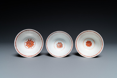 Eight Chinese famille rose plates and three famille verte cups, Kangxi/Qianlong