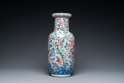 A Chinese pink-ground famille rose rouleau vase, 19th C.