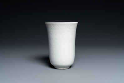 A Chinese white-glazed anhua-decorated 'peony' cup, Xuande mark, Kangxi