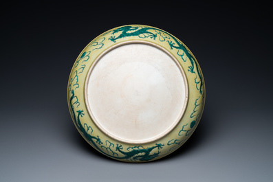 A Chinese yellow-ground famille verte 'dragon' dish, probably Qianlong