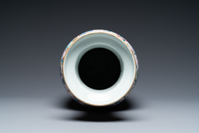 A Chinese pink-ground famille rose rouleau vase, 19th C.