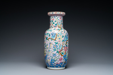 A Chinese pink-ground famille rose rouleau vase, 19th C.