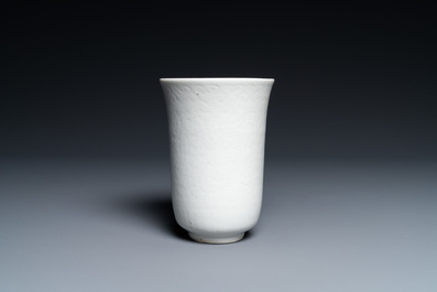 A Chinese white-glazed anhua-decorated 'peony' cup, Xuande mark, Kangxi