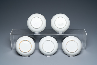 Twenty-two Chinese blue and white and famille rose cups and nineteen saucers, Kangxi and later