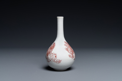 A small Chinese copper-red bottle vase with Buddhist lions, Kangxi