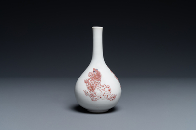 A small Chinese copper-red bottle vase with Buddhist lions, Kangxi