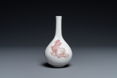 A small Chinese copper-red bottle vase with Buddhist lions, Kangxi