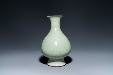 A Chinese monochrome celadon-glazed 'yuhuchunping' vase with underglaze floral design, Kangxi mark, 19th C.