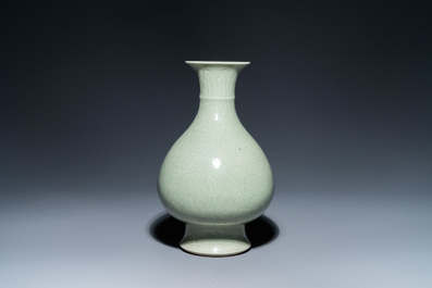 A Chinese monochrome celadon-glazed 'yuhuchunping' vase with underglaze floral design, Kangxi mark, 19th C.