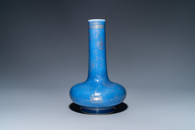 A Chinese gilt-decorated powder blue-ground bottle vase, Kangxi mark, 19th C.