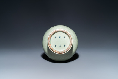 A Chinese monochrome celadon-glazed 'yuhuchunping' vase with underglaze floral design, Kangxi mark, 19th C.