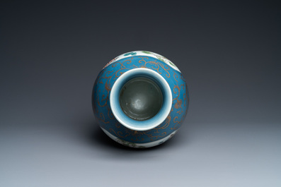 A Chinese famille rose gilt-decorated blue-ground vase, 18/19th C.
