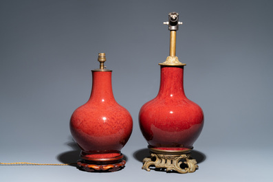 Two Chinese monochrome sang de boeuf-glazed bottle vases transformed into lamps, 19th C.