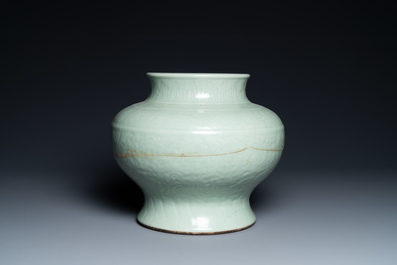 A Chinese monochrome celadon vase with underglaze floral design, Chenghua mark, Kangxi