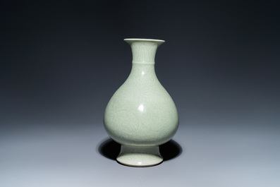 A Chinese monochrome celadon-glazed 'yuhuchunping' vase with underglaze floral design, Kangxi mark, 19th C.