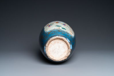 A Chinese famille rose gilt-decorated blue-ground vase, 18/19th C.