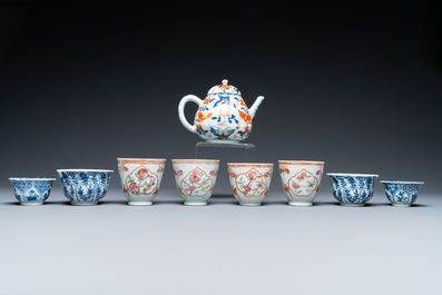 Eight Chinese blue and white and famille rose cups and saucers and an Imari-style teapot, Kangxi/Qianlong