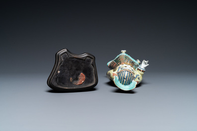 A Chinese famille verte figure on wooden stand, Kangxi