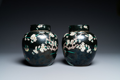A pair of Chinese famille noire jars and covers, 19th C.