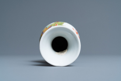 A Chinese famille rose vase with a man and a woman in a garden, Yongzheng