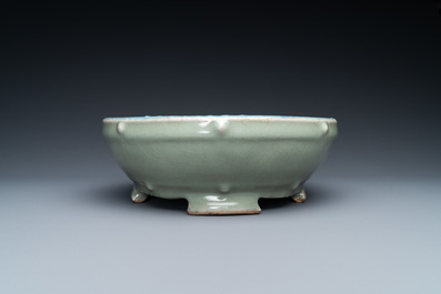 A Chinese enamelled celadon-glazed censer with a dragon on a lotus-shaped wooden stand, Qing