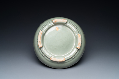 A Chinese enamelled celadon-glazed censer with a dragon on a lotus-shaped wooden stand, Qing