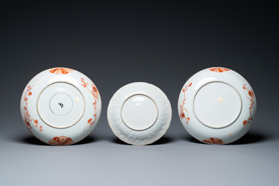 A pair of Chinese iron-red and gilt dishes and a lotus-molded plate, Kangxi
